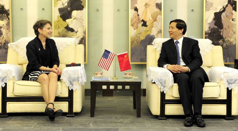 University of Maine at Farmington President Kathryn Foster meets with Guo Guangsheng, her counterpart at Beijing University of Technology, in Beijing during an event commemorating the 25th anniversiary of a collaboration between the two institutions.