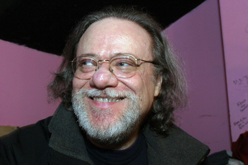 In this Jan. 8, 2005, photo, Tommy Ramone, ex-drummer and manager of The Ramones, smiles as he is interviewed backstage at the Knitting Factory in New York. A business associate says Ramone, a co-founder of the seminal punk band The Ramones and the last surviving member of the original group, has died. He was 65.