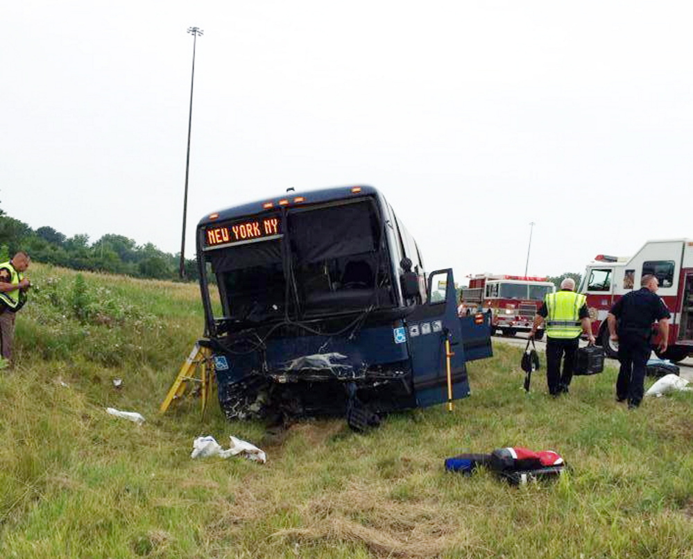 Emergency personnel respond to the scene of a bus accident on Sunday on interstate 70 near Richmond, Ind.