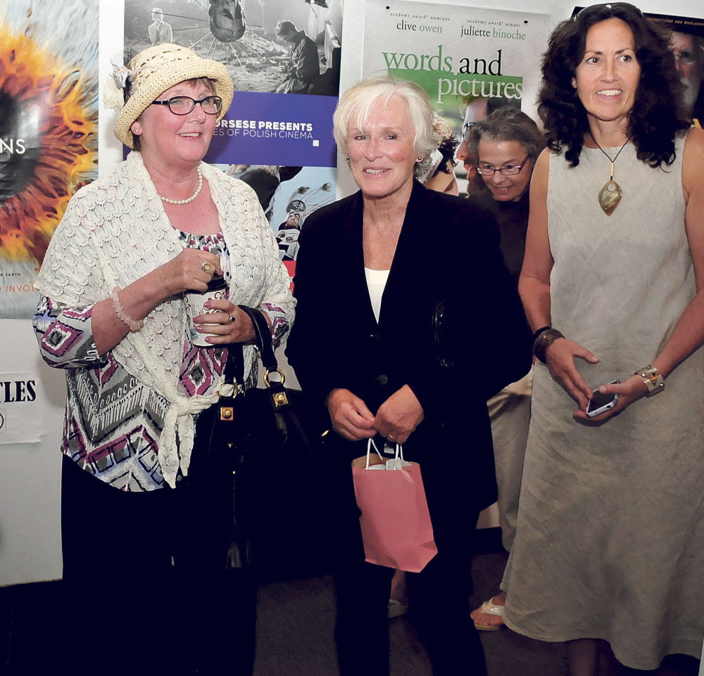 Actress Glenn Close, center, is escorted by Cheryl McKenney, left, and Arleen King-Lovelace on Sunday after speaking with movie fans at Railroad Square Cinema in Waterville. Close received the Maine International Film Festival’s Mid-Life Achievement award.