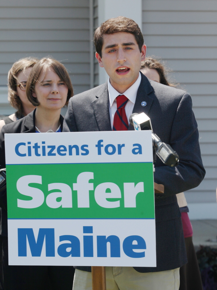 SOUTH PORTLAND, ME – JULY 14: David Boyer, Maine Political Director of the Marijuana Policy Project, joined by Democratic congressional candidate Shenna Bellow, left, speaks at a news conference, Monday, July 14, 2014 outside the South Portland City Hall. The group turned in signed petitions in support of an initiative to make marijuana possession legal for adults in city limits.  (Photo by Joel Page/Staff Photographer)