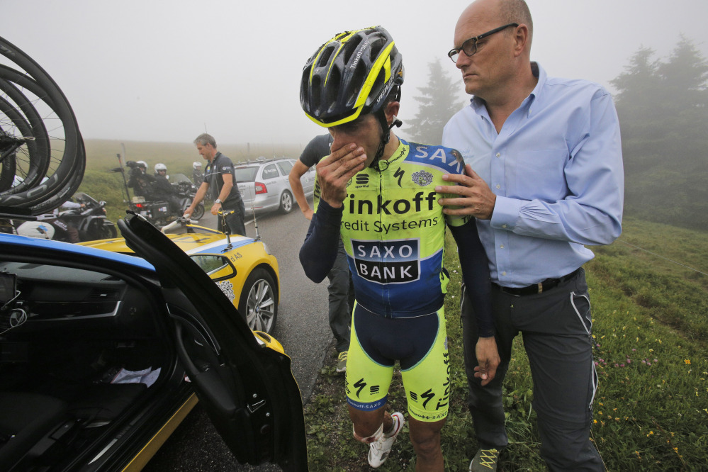 Spain’s Alberto Contador abandons the race after crashing during the tenth stage of the Tour de France cycling race over 161.5 kilometers (100.4 miles) with start in Mulhouse and finish in La Planche des Belles Filles, France, Monday.