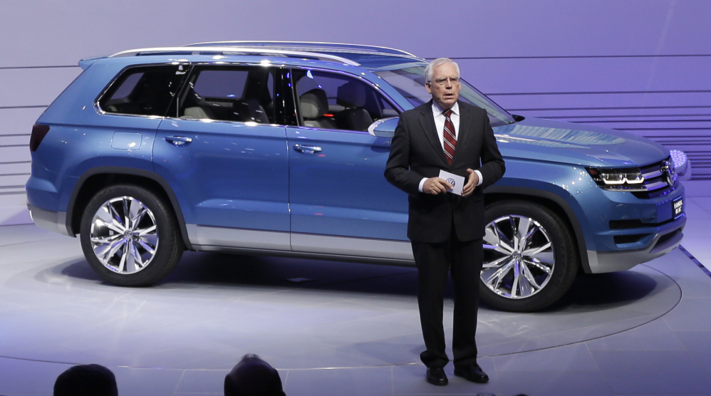 Ulrich Hackenberg, Volkswagen Director of Product Development for Power Trains, stands next to the Volkswagen CrossBlue SUV concept vehicle in Detroit on Jan. 14, 2013.