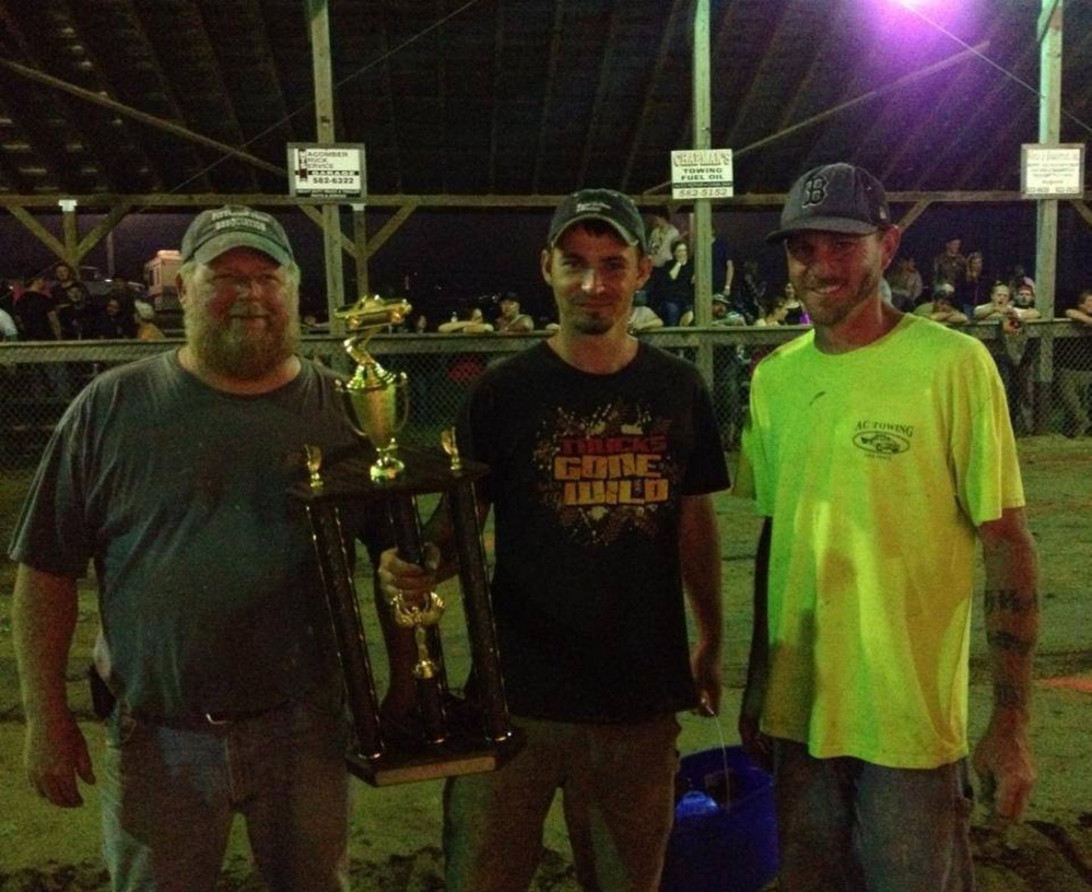 Ron Poore of Gardiner was chosen as the 2014 PowerHouse Winner from the Maine 4x4 Festival that was held at the Pittston Fair. Poore competed and placed in multiple events. This award is voted on by the Pittston Fair Association members. From left are Pete Weeks, vice president of the Pittston Fair Association; Poore; and association member Travis Chiasson.
