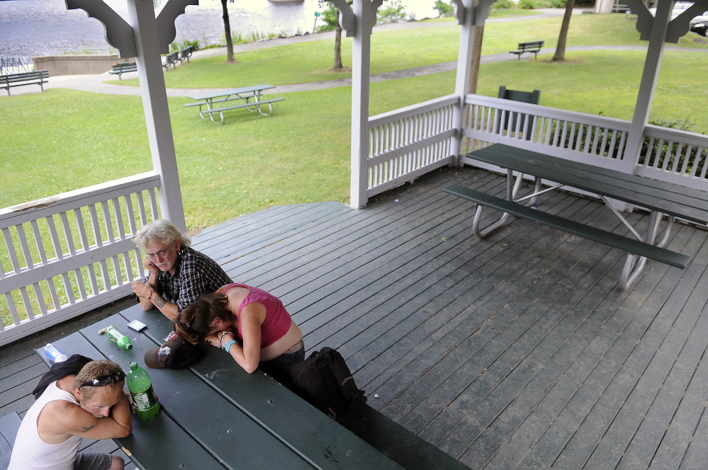 Joseph McKenna, left, Barry Sheffield and Ann Meserve sit Tuesday in the gazebo on the Kennebec River in Augusta.  Augusta City Councilors meet Thursday to consider allocating $14,000 to fund an increased police presence downtown for the rest of summer. “It’s not against the law to take a nap,” Sheffield said.  “This is someplace to go and watch bald eagles catch fish.”