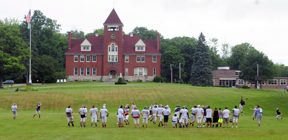 The East team practices before media day at the Lobster Bowl on Tuesday at Hebron Academy.