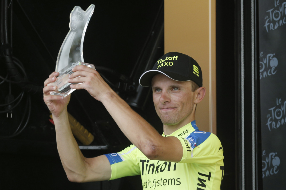 Stage winner Poland’s Rafal Majka celebrates on the podium of the 14th stage of the Tour de France cycling race on Saturday.