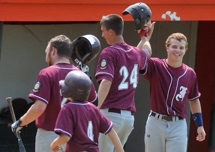 Members of the Franklin County Flyers celebrate after scoring against Gardiner in the Senior Legion Zone 2 baseball tournament at Memorial Field in Skowhegan on Saturday.