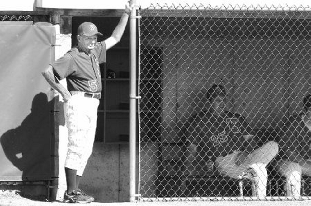 Dr. John Winkin watches his Bangor American Legion team warm up for a 2008 state tournament game against Monmouth. Winkin, 94, died Saturday.