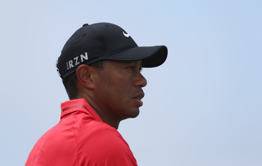 Tiger Woods looks along the 13th fairway during the final round of the British Open on Sunday. Woods finished in 69th place.