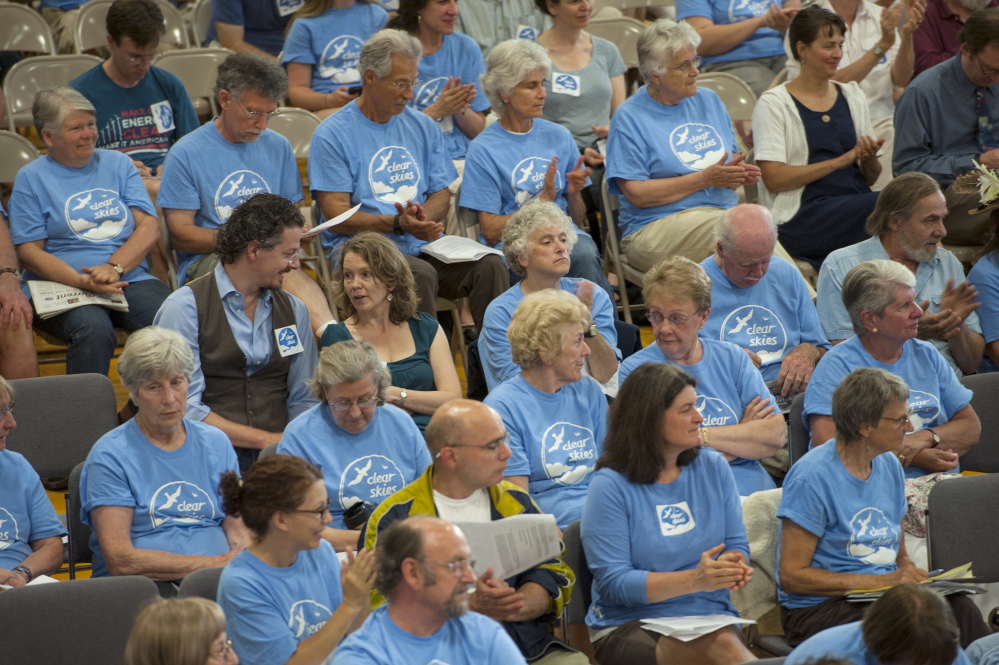 Citizens in favor of the ban to keep tar sand oil from entering the harbor in South Portland wear blue shirts to show their support during the South Portland City Council on Monday. Logan Werlinger/Staff Photographer