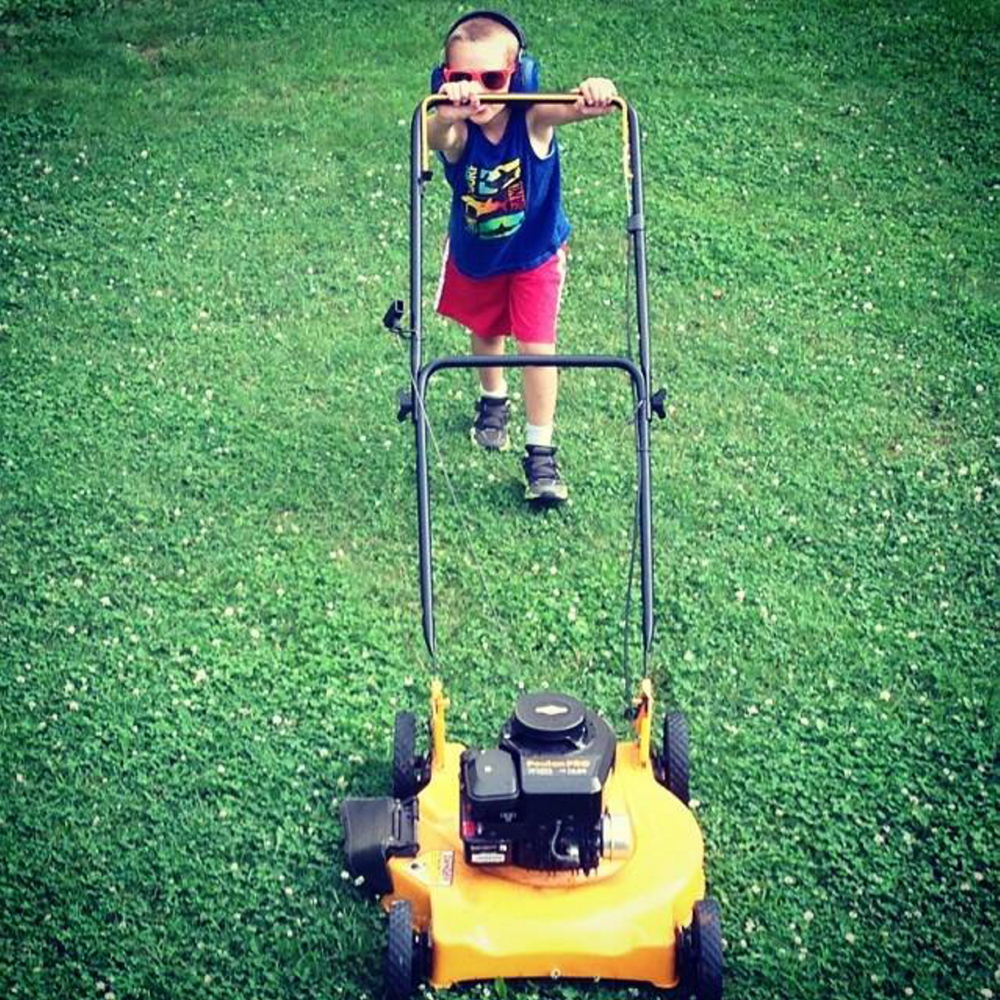 Photo courtesy of Heather Blanchet 
 Gage Blanchet, 6, practices mowing the lawn at his home in Canaan. The mower was not running.
