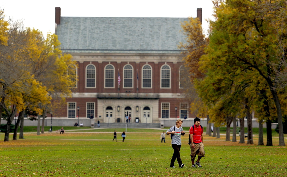 Students walk on the mall at the University of Maine in Orono, the flagship campus of the state university system.