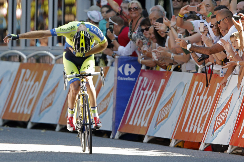 Australia’s Michael Rogers bows for cheering spectators as he crosses the finish line to win the sixteenth stage of the Tour de France cycling race over 147 miles with start in Carcassonne and finish in Bagneres-de-Luchon, France, Tuesday.