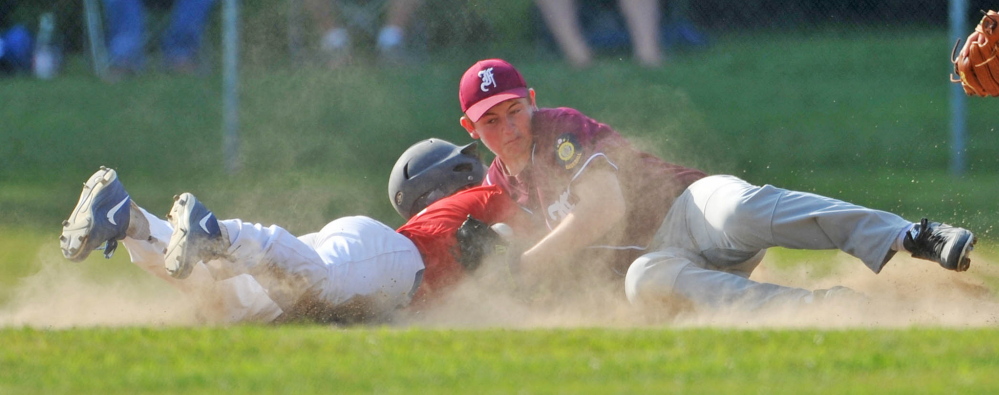 Post 51 baserunner Zach Mathieu is tagged out at second base after over-sliding the bag in the first inning in the American Legion Zone 2 championship game at Memorial Field in Skowhegan on Tuesday.