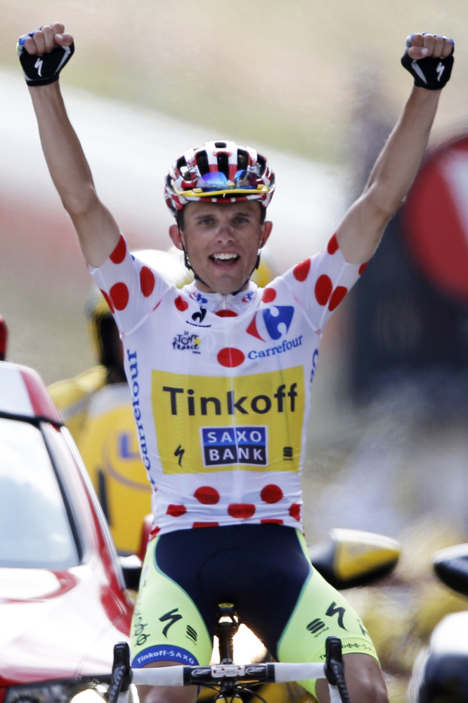 Poland’s Rafal Majka crosses the finish line to win the seventeenth stage of the Tour de France cycling race over 124.5 kilometers (77.4 miles) with start in Saint-Gaudens and finish in Saint-Lary, France, Wednesday.