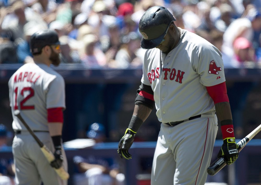 Boston Red Sox designated hitter David Ortiz looks down and makes his way back to the dugout after striking out against the Toronto Blue Jays during the fourth inning of Thursday’s game in Toronto.