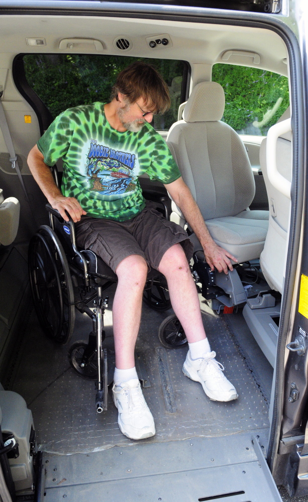 Staff photo by Joe Phelan
Steve Brown demonstrates how the driver’s seat of his 2011 Toyota Sienna turns around so that he can transfer from his wheelchair on Wednesday in Richmond. The van has a spinner steering wheel and a push right angle handle to control acceleration and stopping.