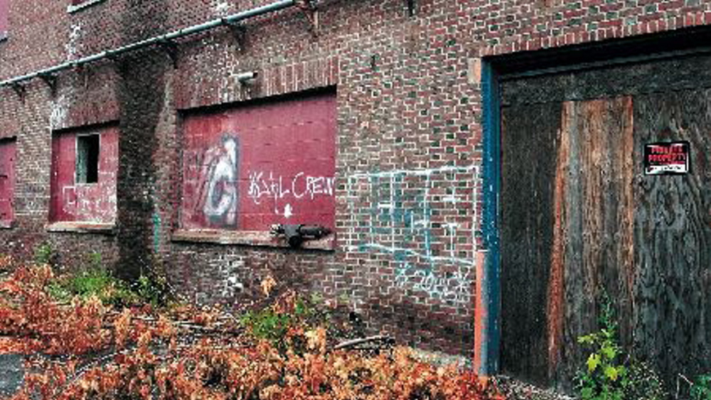 Boarded up, crumbling and marked by graffiti, the former Harris Baking Co. building once employed hundreds of workers who produced thousands of loaves of bread each week. Since closing after the decline of home-delivered baked goods, the building has fallen into disrepair, but is expected to soon become the manufacturing plant for a unique product, fire logs made of hay.