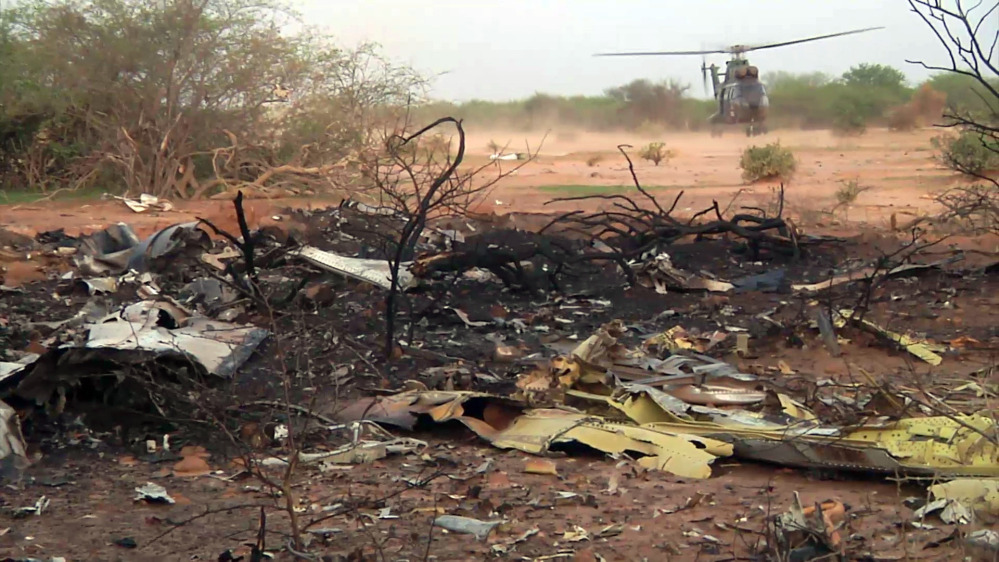 A helicopter lands at the site of the Air Algerie plane crash in Mali on Friday in this photo provided by the French army.