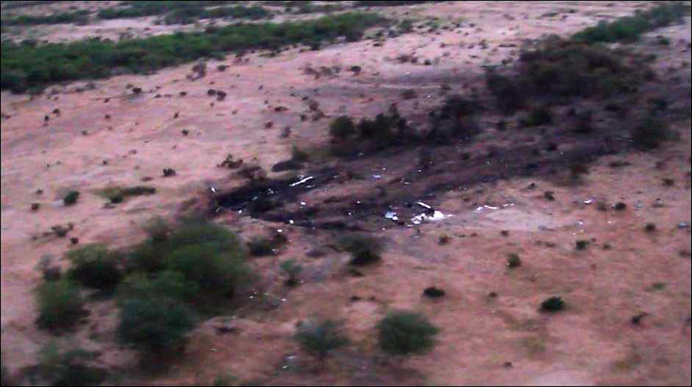 This photo provided by the French army shows the site of the plane crash in Mali on Friday. French soldiers secured a black box from the Air Algerie wreckage site in a desolate region of restive northern Mali, the French president said.