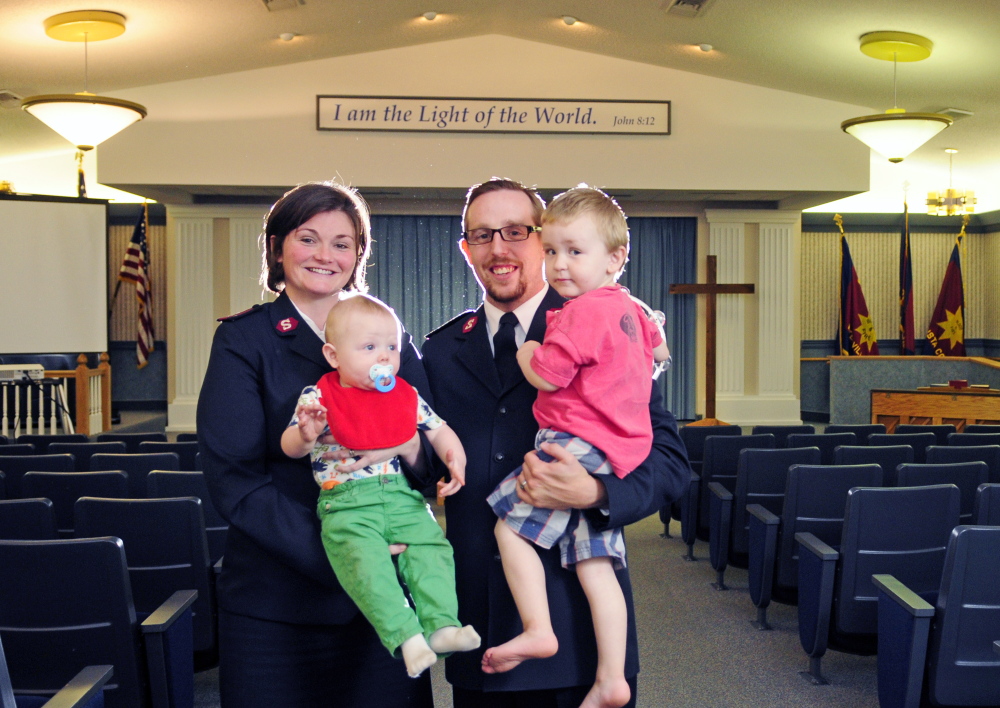 New Salvation Army officers Lt. Kama Lyle, left, and Lt. Joel Lyle pose with their children Dylan, 8 months, and Jordan, 2, on Thursday in Augusta.
