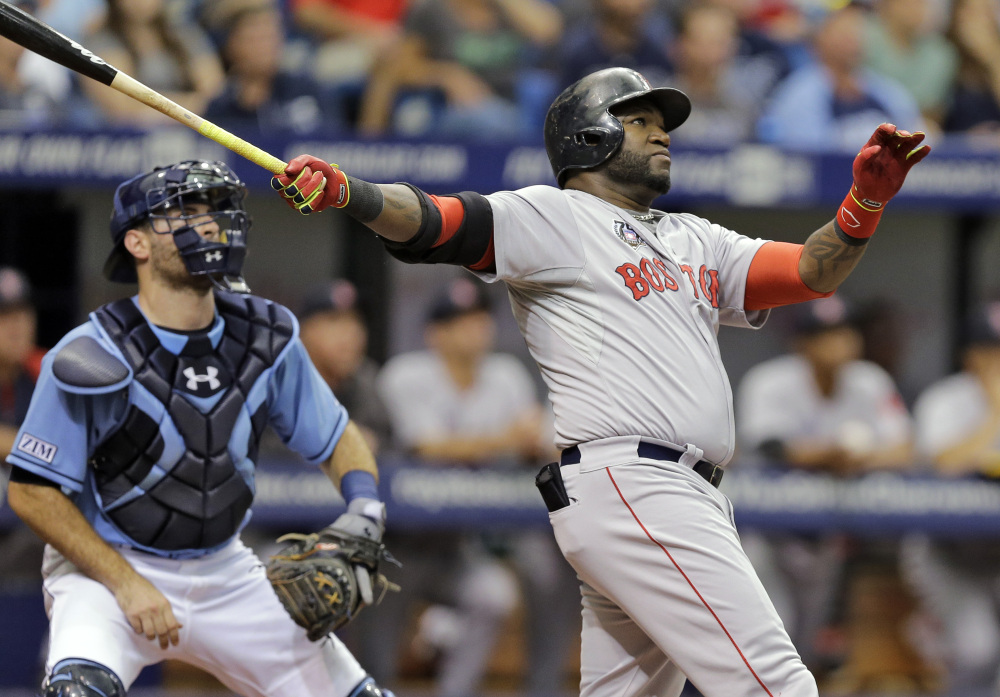 Boston’s David Ortiz watches his three-run home run off Tampa Bay starting pitcher Chris Archer during the third inning Sunday in St. Petersburg, Fla. Boston’s Daniel Nava and Dustin Pedroia also scored. Catching for the Rays is Curt Casali.