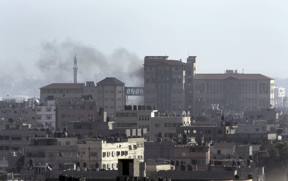 Smoke from an Israeli strike rises over a building in Gaza City in the northern Gaza Strip on Sunday.