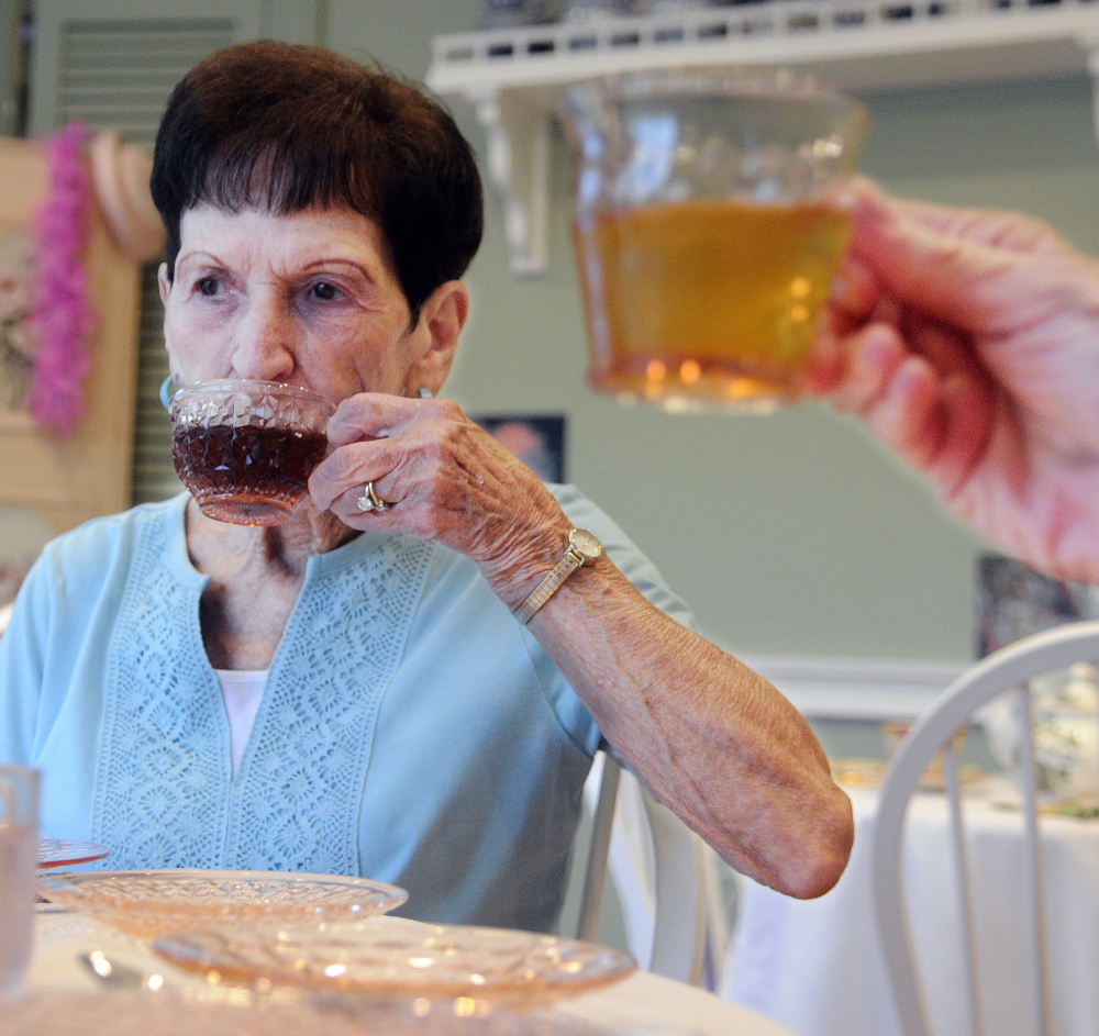 Phyllis Lynch, left, and Diane Jerome have tea Monday at the Blue Willow Tea Room in Randolph.