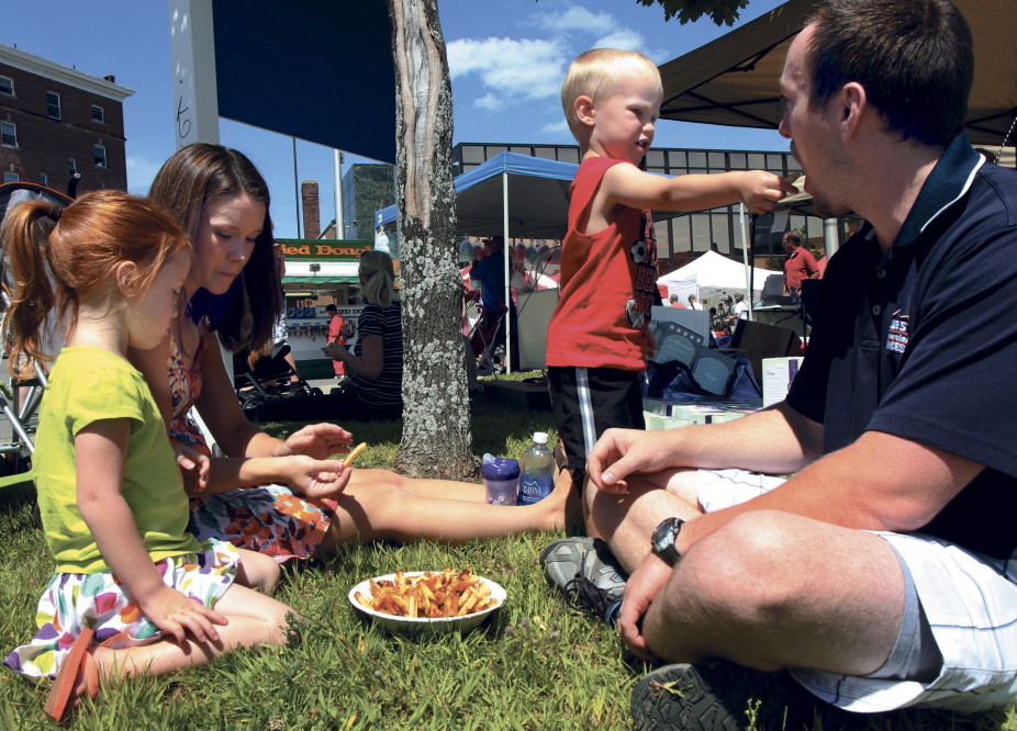 Liam Rose, 3, gives his dad Phil a French fry while enjoying the Taste of Greater Waterville last summer with his sister Isabelle and mother Heather. This years event, now named The Taste of Waterville, will be Wednesday, Aug. 6.