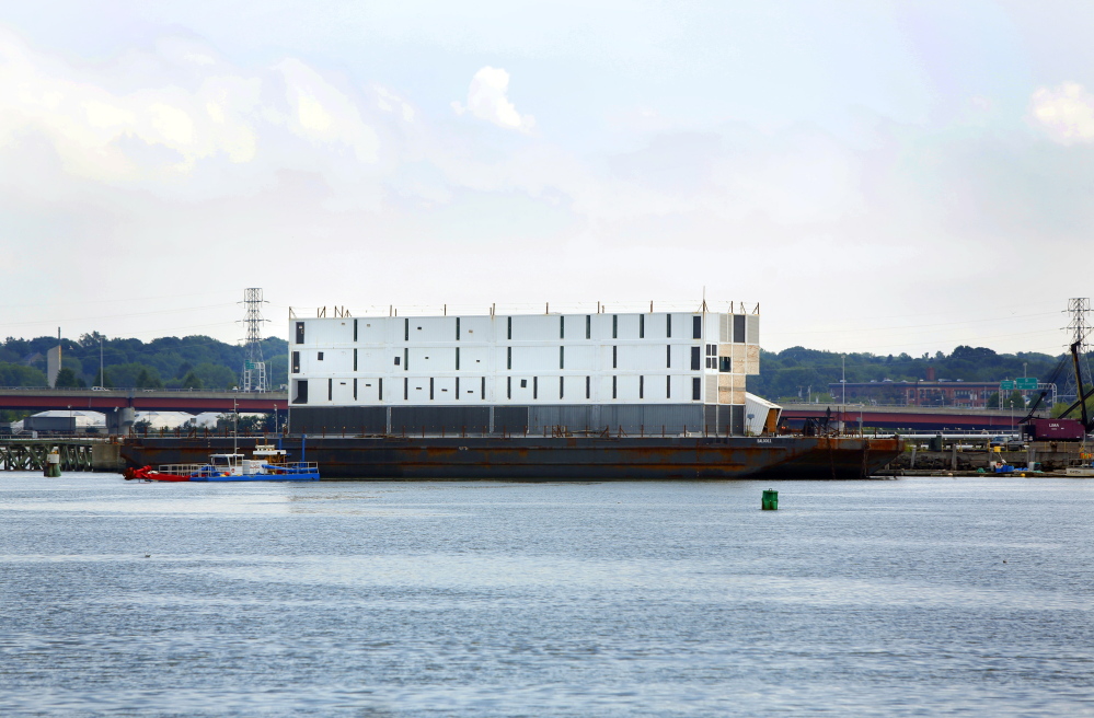 Google’s four-story barge sits in Portland Harbor. The barge was moved Wednesday to South Portland where it is being prepared for what was called “an ocean voyage.” Little to no construction has been done on the structure since it showed up in Maine last October.