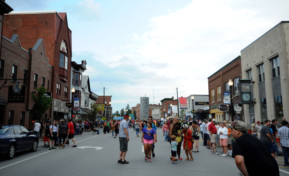 People gather on Main Street in downtown Skowhegan for the annual River Fest in this file photo from July 2014.
