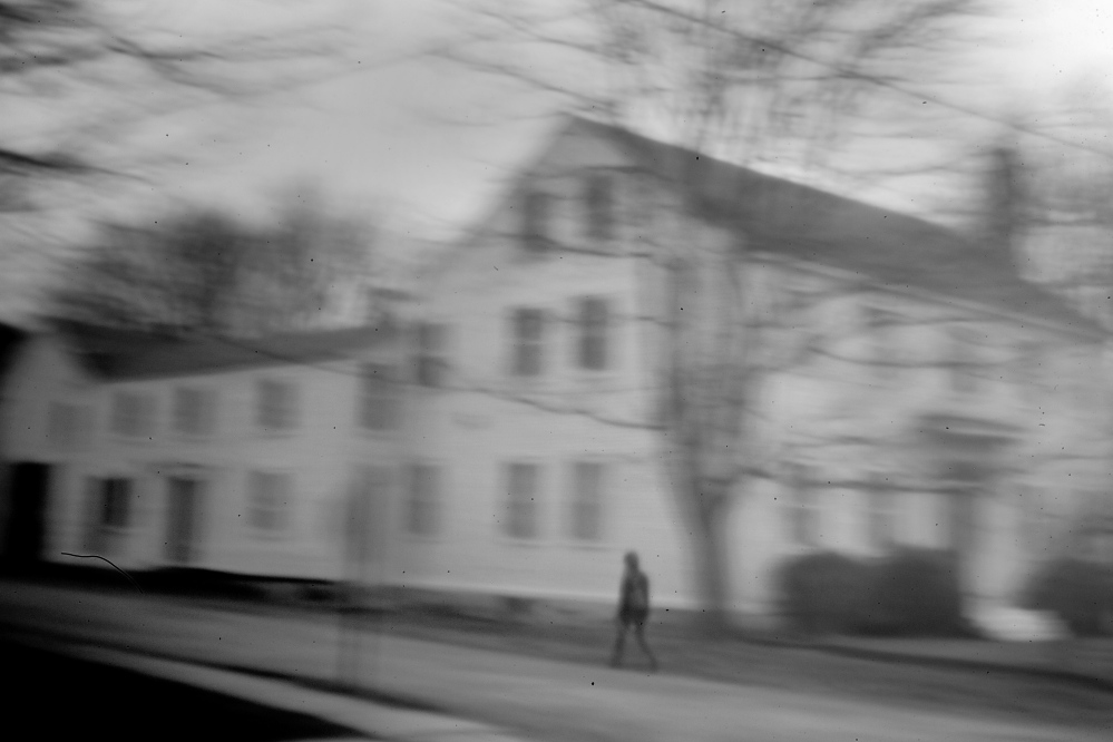 A woman walks past the Eastport house that Don Gellers called home when he represented the Passamaquoddys in the 1960s. Gellers was arrested here in 1968, right after filing a $150 million land claims suit for the tribe, on charges of “constructive possession” of marijuana cigarettes.
