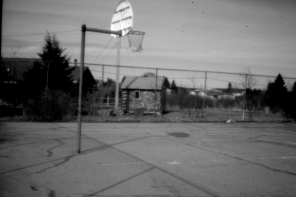 A run-down basketball court at Pleasant Point. Decades after the land claims pact,, Maine’s Passamaquoddy reservations have become uneasy places to thrive. Ira Gilbert, an unemployed tribal member at Indian Township, puts it succinctly: “There’s a big law problem here: There is none.”