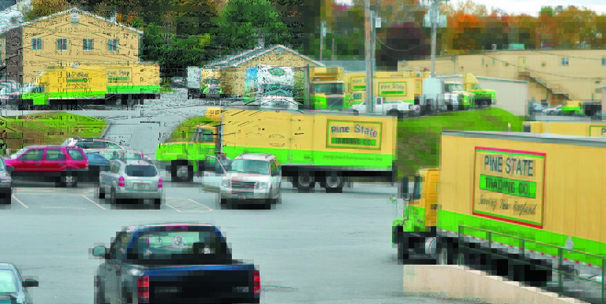 Trucks come and go at Pine State Trading Co. and the Maine Beverage Co. offices in Augusta. Pine State Trading Co. is the only firm to rebid for the state liquor marketing contract. A former challenger, Dirigo Spirit, did not submit a second bid.
