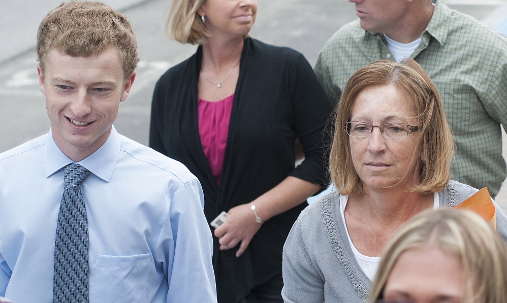 Carole J. Swan, former Chelsea selectwoman, with her younger son John Swan, as they enter the U.S. District Court building in Bangor for her sentencing hearing in June on extortion, tax fraud and workers compensation fraud.