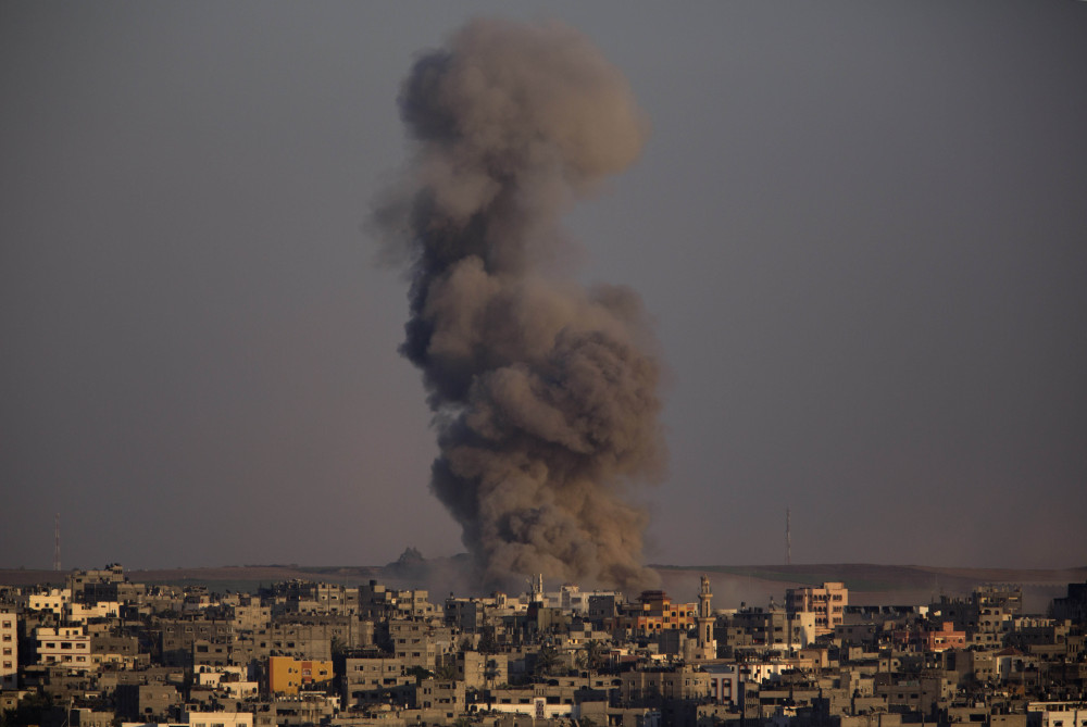 Smoke rises after an Israeli airstrike in Gaza City, Sunday.