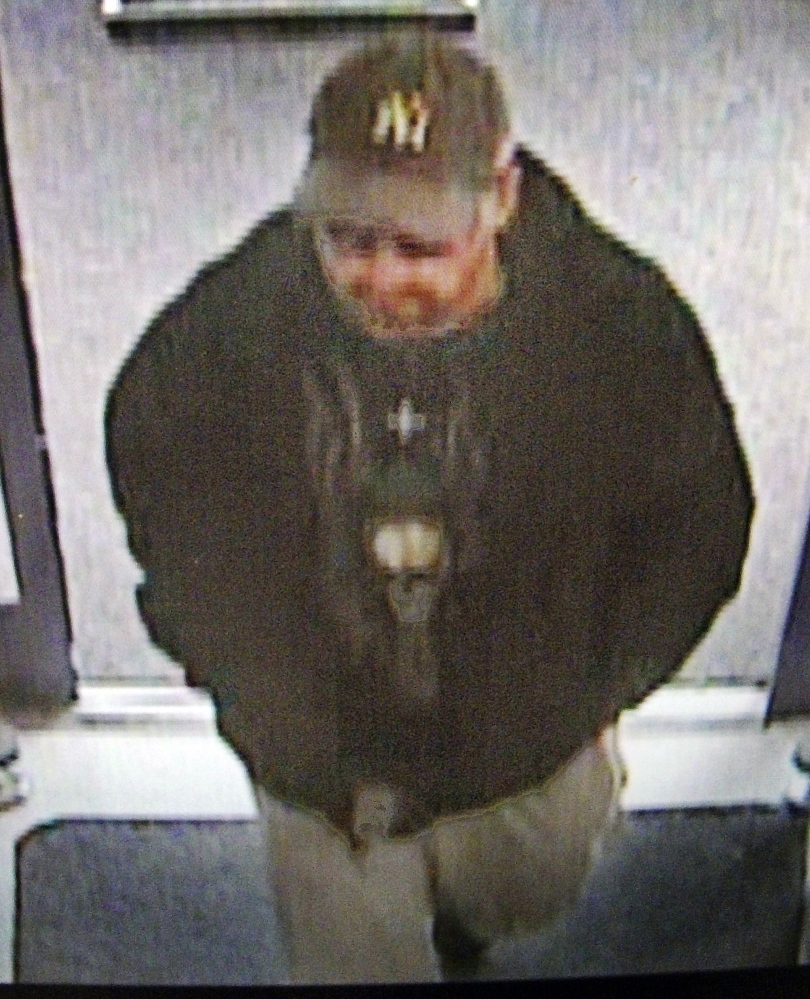 A surveillance photo shows a suspect who allegedly robbed the Rite Aid pharmacy in Manchester on Sunday.