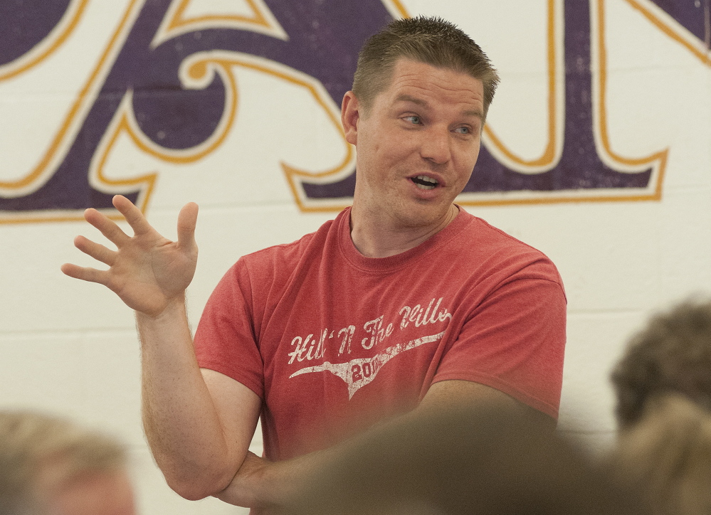 Waterville City Councilor Eric Thomas lobbies for anyone to step forward and be a nominee for Kennebec Water Disctrict trustee during the Waterville Democratic caucus at Waterville Senior High School on Sunday.