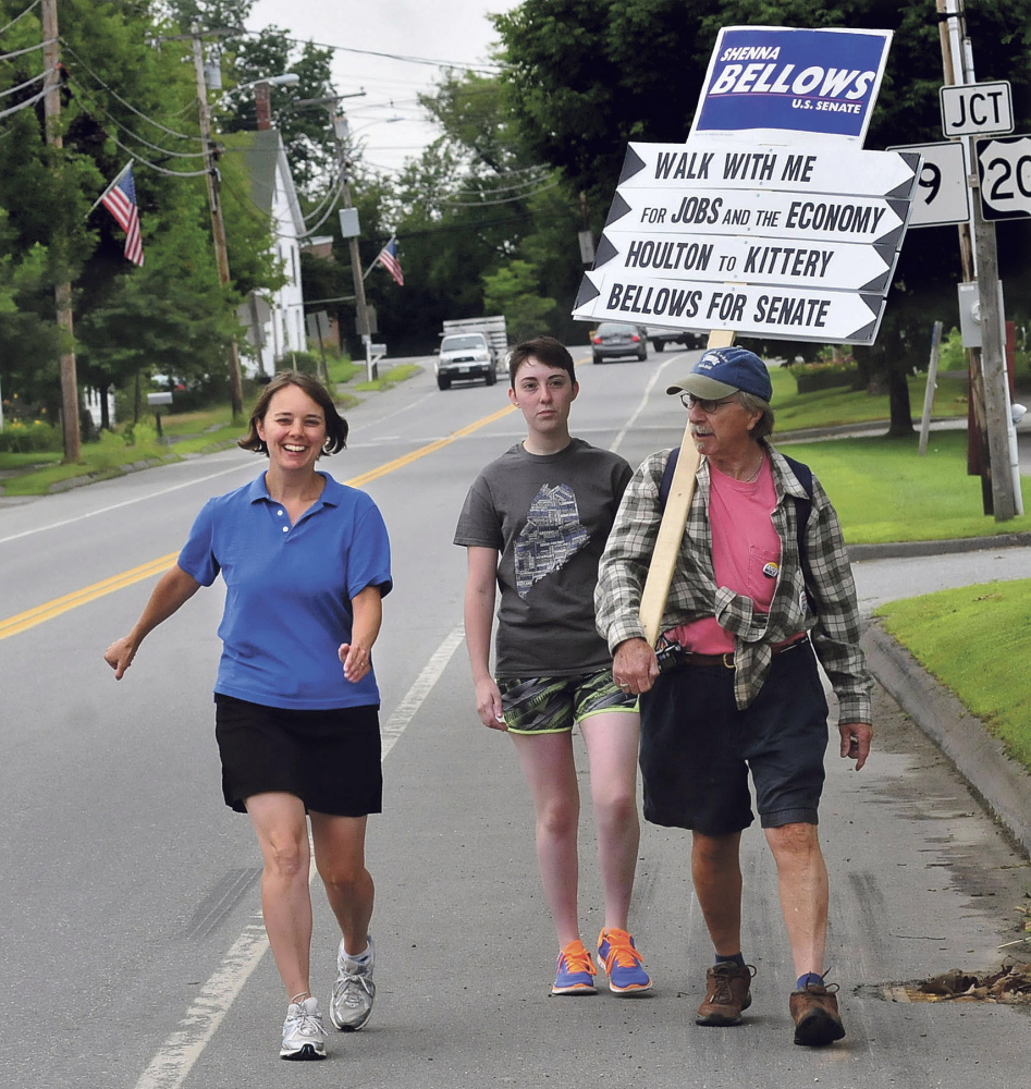 UNITY,ME.-July 31: Democrat U.S. Senate candidate Shenna Bellows, left, continued her campaign trek across Maine as she walked along School Street in Unity on way to stops in Waterville and Fairfield early Thursday morning. Volunteers McKayla Reed and Jeff Smith accompany Bellows. (Photo by David Leaming/Staff Photographer)