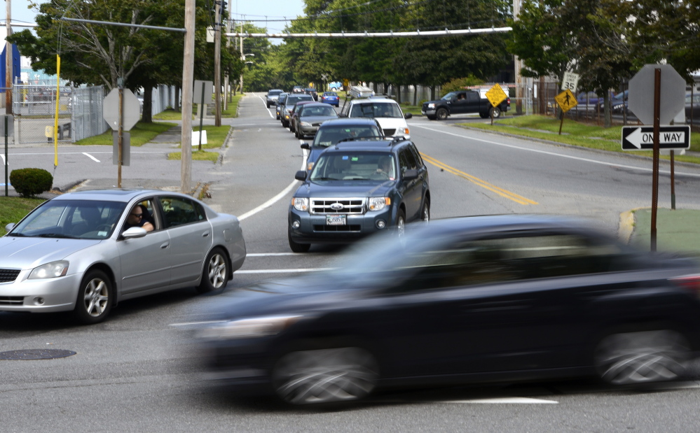 Motorists try to merge as traffic is backed up on Warren Avenue entering Cumberland Street in Westbrook during the afternoon commute.