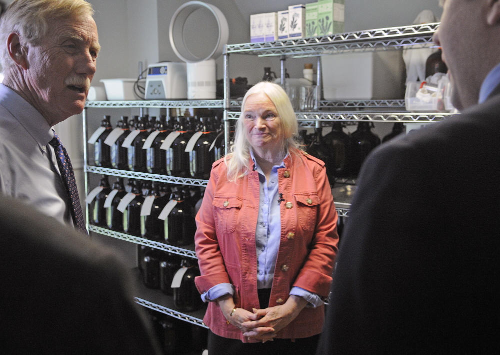 Maine Medicinals CEO Edie Johnston speaks Monday with U.S. Senator Angus King, left, and U.S. Small Business Administration regional administrator Seth Goodall in the laboratory of her Dresden business. The manufacturer of elderberry syrup recently received a 2014 Tibbetts Award for its technological innovation in the nutraceutical field from the U.S. Small Business Administration.