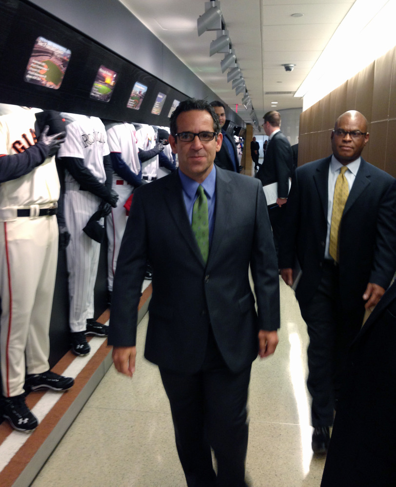FILE - In this Sept. 30, 2013, file photo provided by Fitzpatrick Communications, Anthony Bosch is escorted by Major League Baseball security person Ric Burnham, right, at MLB headquarters in New York.