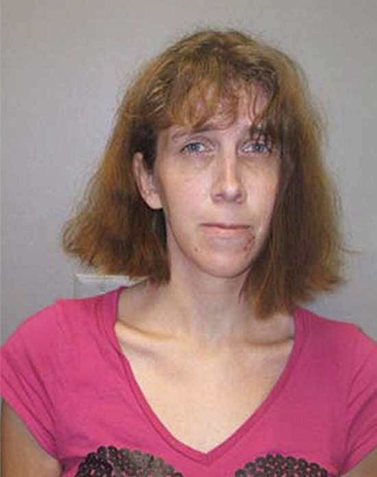 Booking photograph of suspect held in an Ohio jail who refuses to identify herself. Police say the woman may have ties to Kennebec County, and has tried to disguise her appearance and burn off her fingerprints.