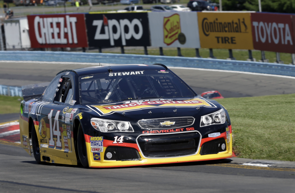 Tony Stewart (14) drives through the s-turns during a qualifying session for Sunday’s NASCAR Sprint Cup Series auto race at Watkins Glen International, Saturday, in Watkins Glen N.Y.