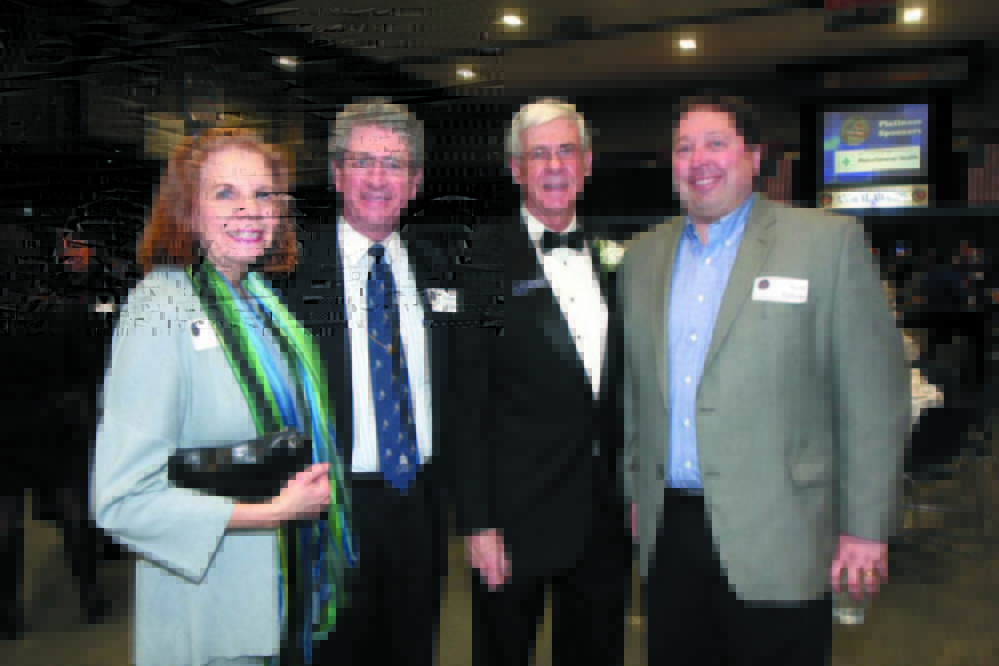 From left, Diane Doyen with husband and then Augusta Mayor William Stokes, Kennebec Valley Chamber of Commerce President Peter Thompson and Scott Upham of Cribstone Capital Managagement at the KV Chamber’s annual awards banquet in January 2013.