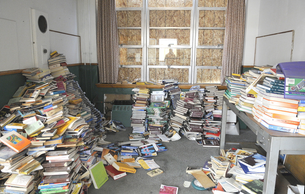In this April file photo, textbooks were stacked up in the office of the former Hodgkins Middle School in Augusta.