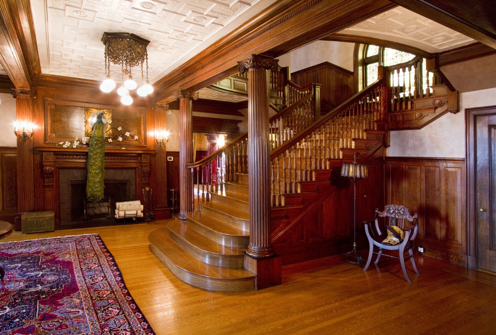 The first floor foyer of the West Mansion, like the rest of the mansion, features elaborate tiger maple woodwork.