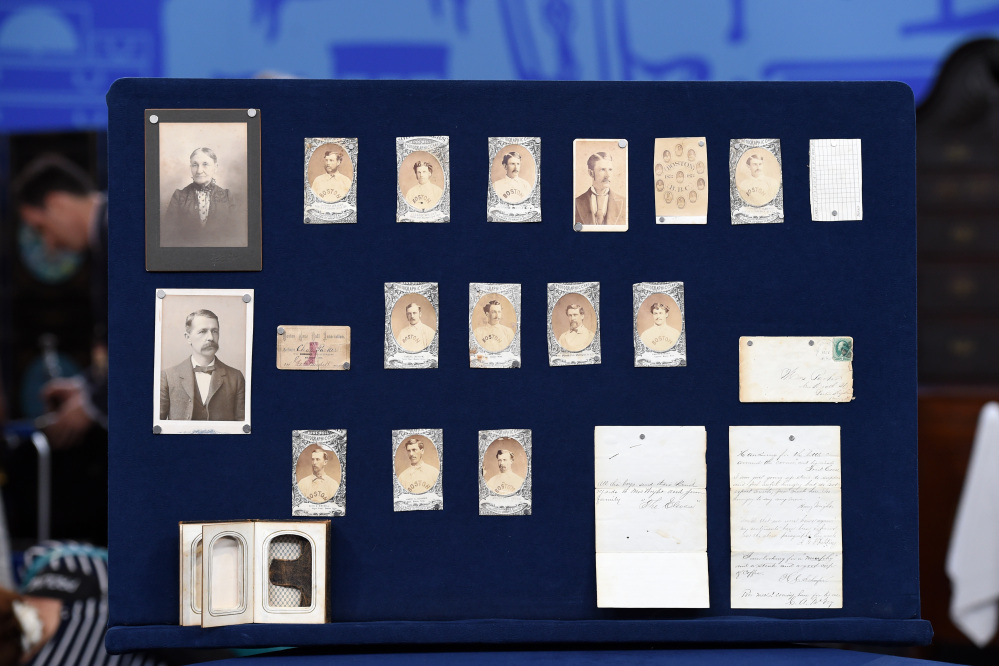 This Aug. 9, 2014 photo released by Antiques Roadshow shows a collection of early Boston baseball memorabilia for the program “Antiques Roadshow” in New York.