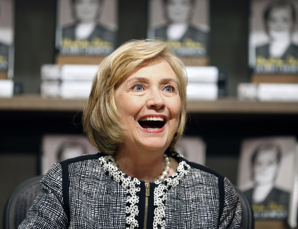 The Associated Press
This July 29, 2014, file photo shows former Secretary of State Hillary Rodham Clinton as she greets a customer during a book signing of her new book “Hard Choices” at Northshire Bookstore in Saratoga Springs, N.Y.